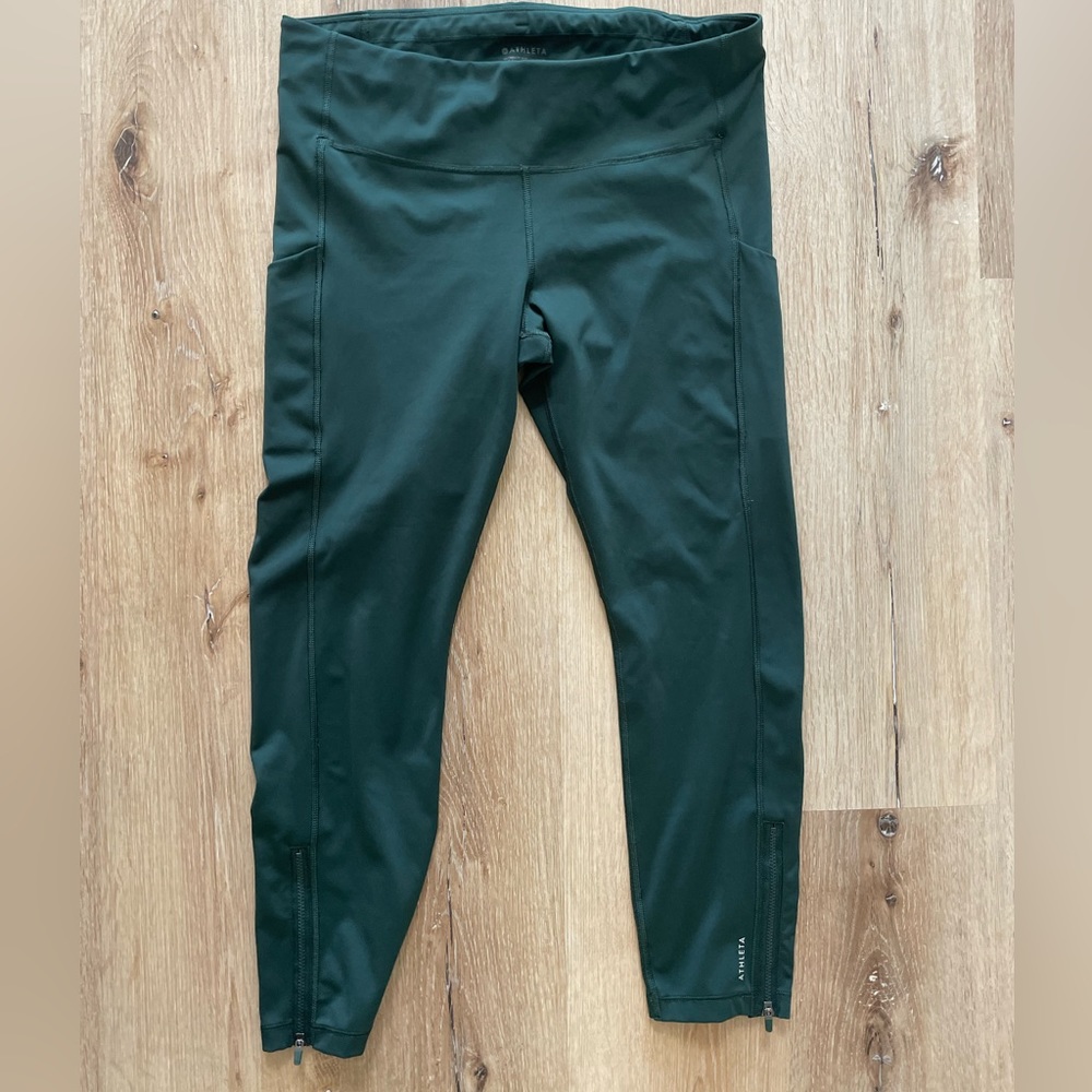 Athleta running tights 7/8 length. Size large. Ultimate stash style. Dark green